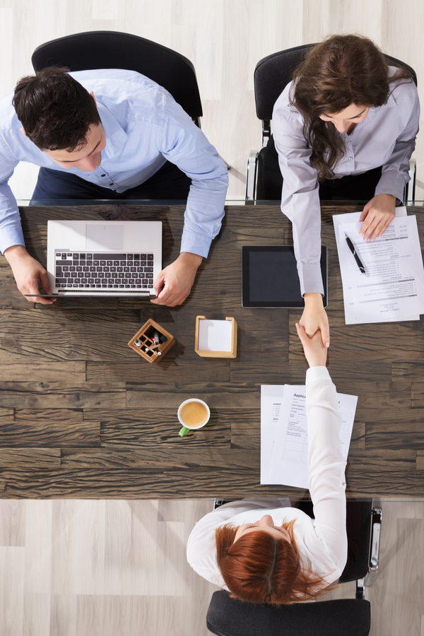 shaking hands to land your dream job