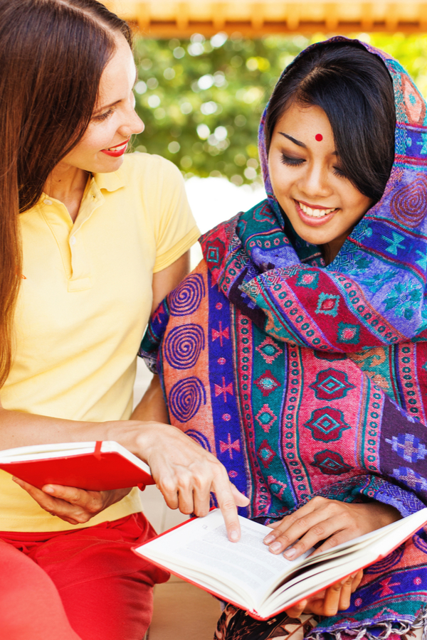 two woman talking about travel takeaways